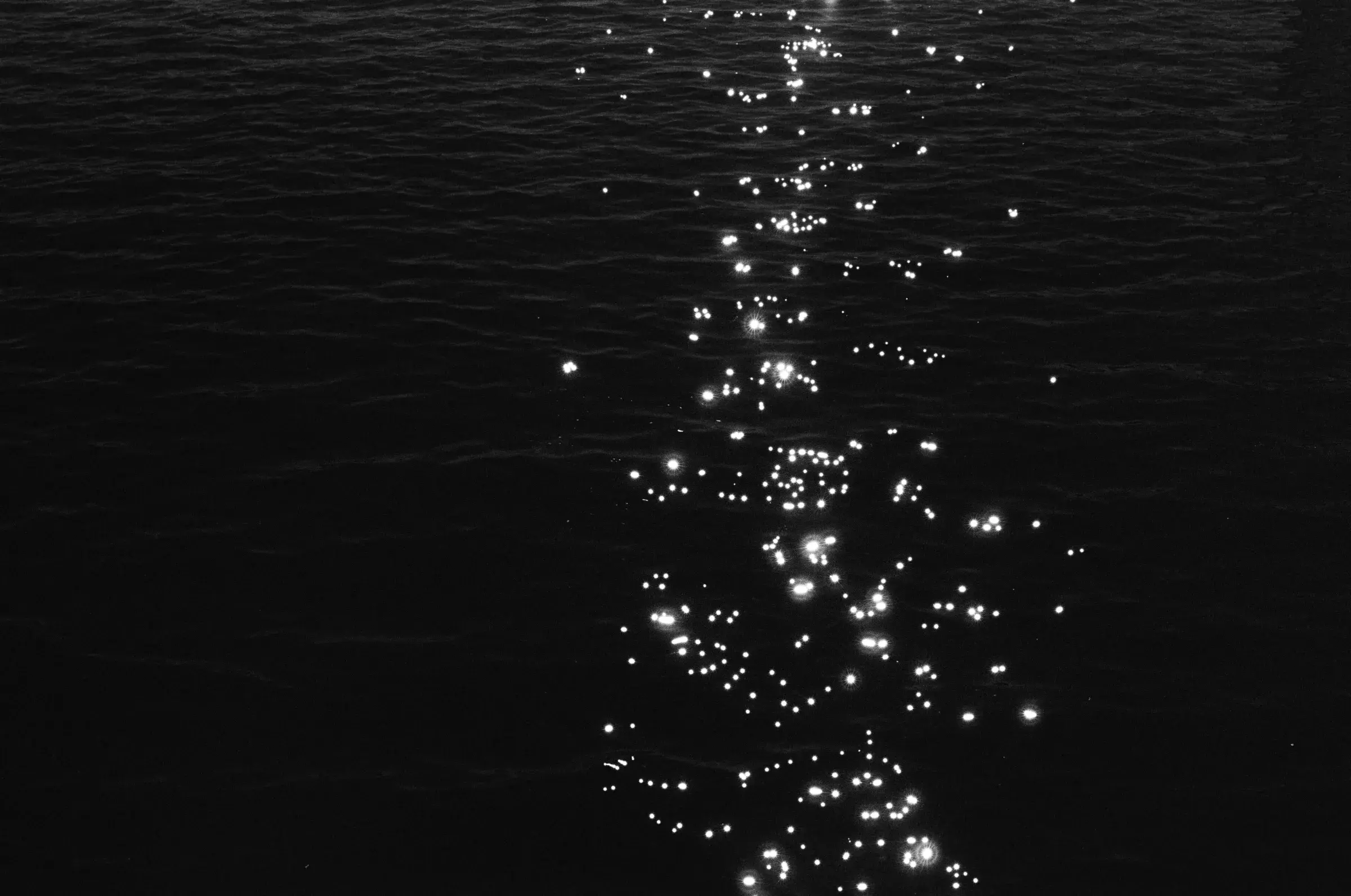 night frame scattered with small white lights against black